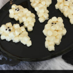 Super fun and spooky Halloween treat that the kids can help make. These Marshmallow Ghosts are frighteningly simple to make.