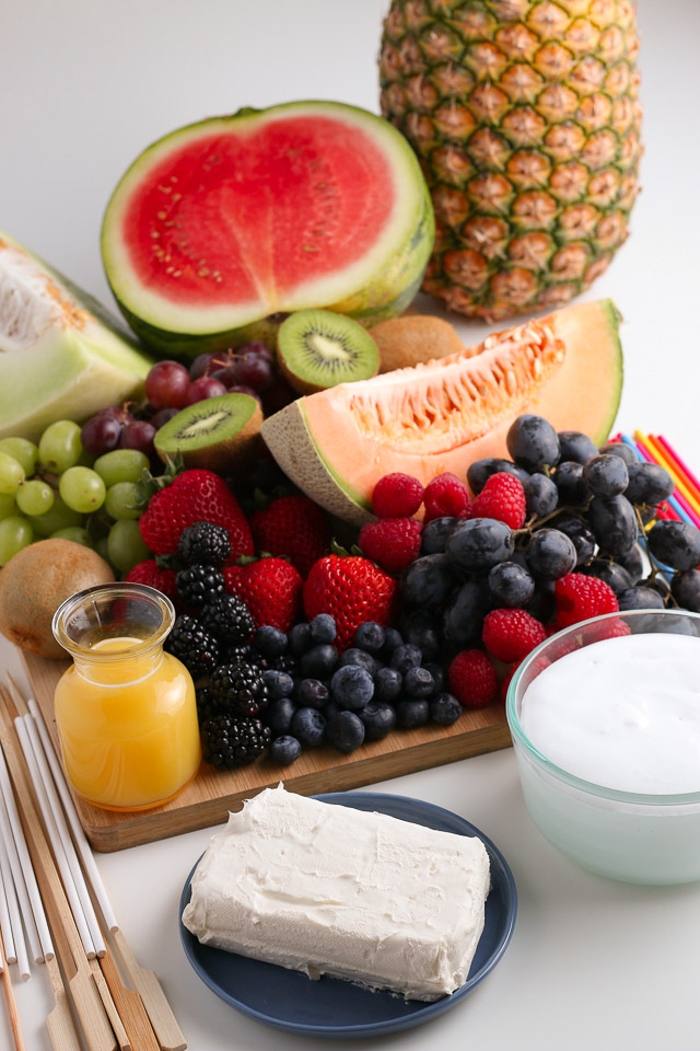 Fruit Kabobs and fruit dip ingredients on cutting board