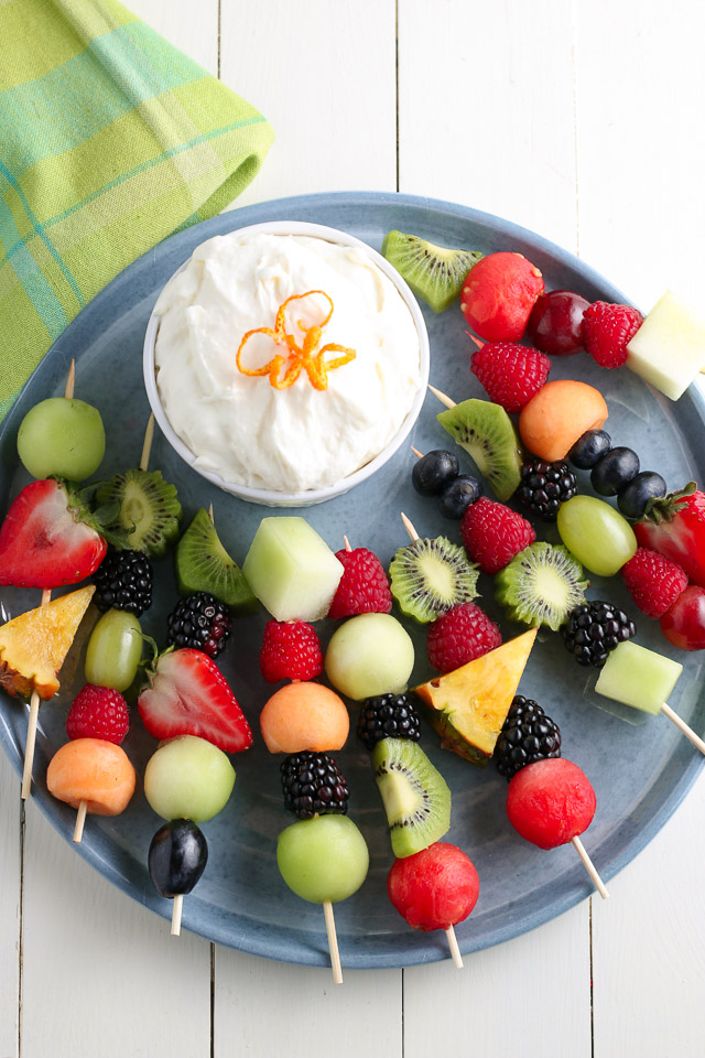 Fruit Kabobs and fruit dip on blue plate for serving