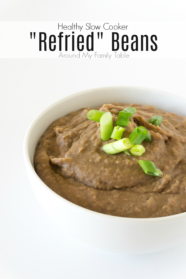 crockpot refried beans in white bowl