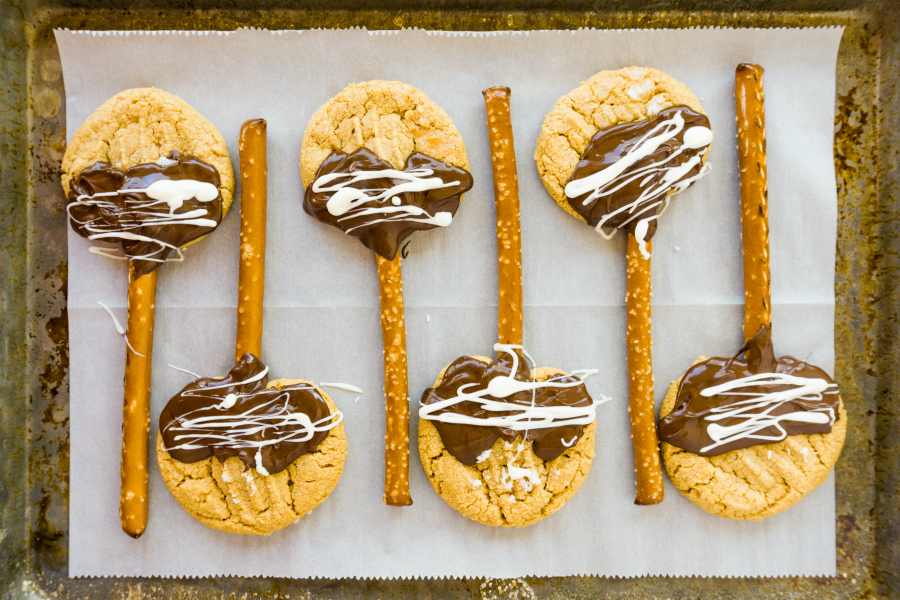 I love turning my simple Peanut Butter Cookie recipe into these fun Halloween Witches Broom Cookies.  Everyone loves a good chocolate and peanut butter dessert!