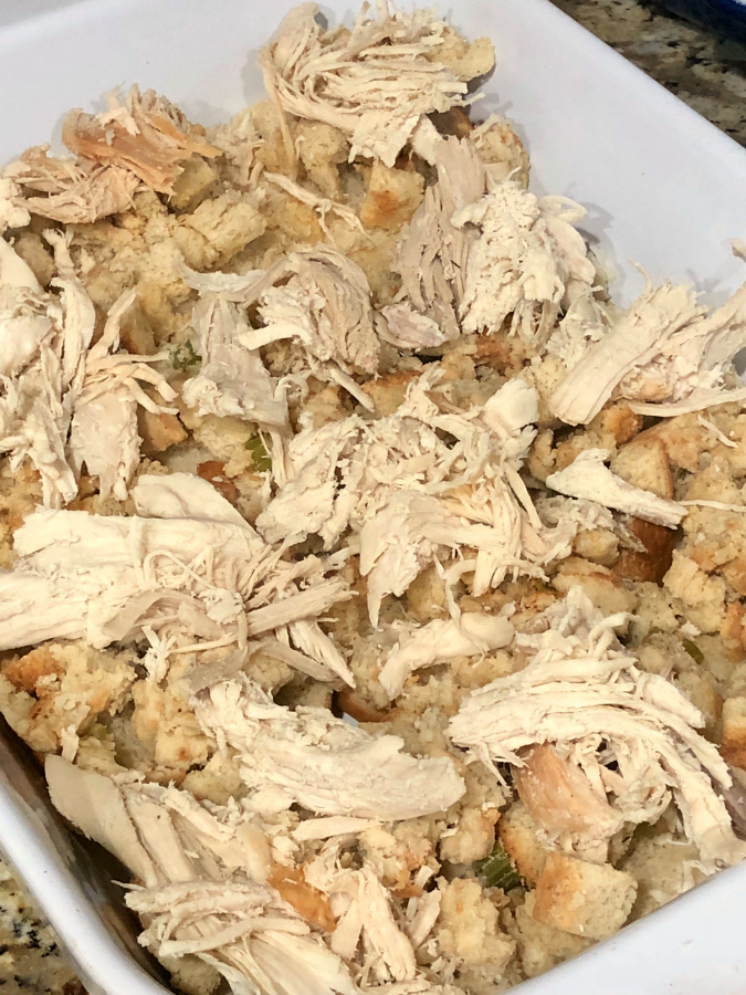 a pan of cranberry turkey sliders showing the turkey layer