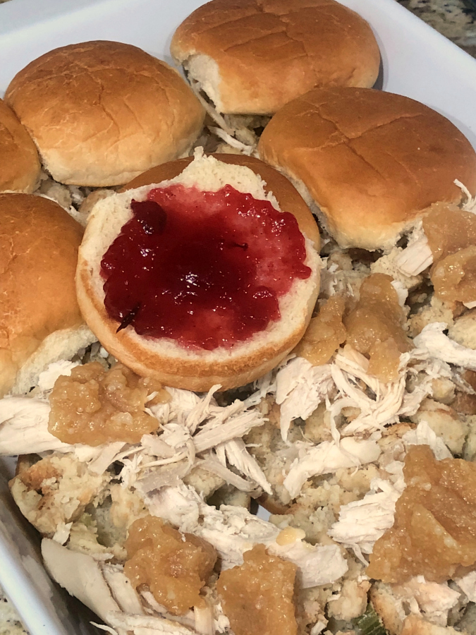 a pan of cranberry turkey sliders showing the cranberry layer