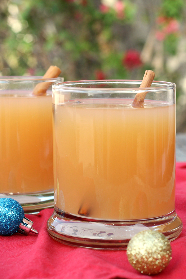 2 glasses filled with Slow Cooker Christmas Wassail. 