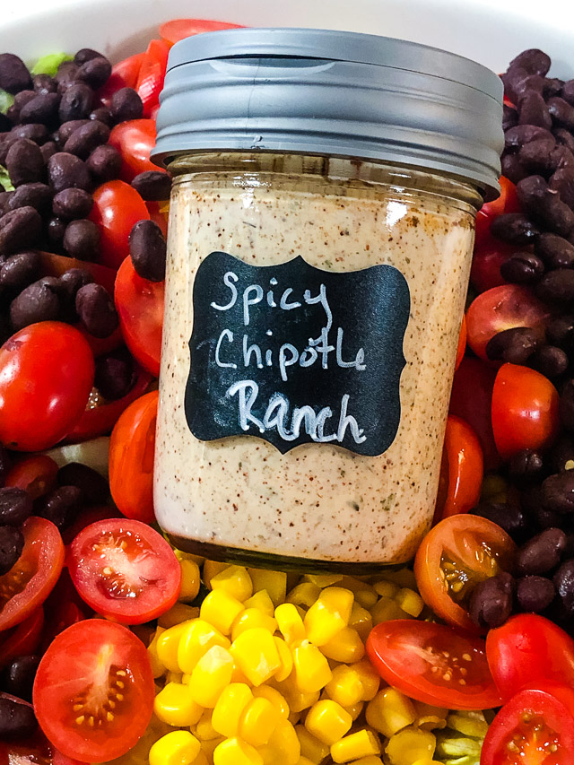 Spice up a bottle of store bought ranch dressing with some chipotle seasoning to make this scrumptious Spicy Chipotle Ranch Dressing. via @slingmama