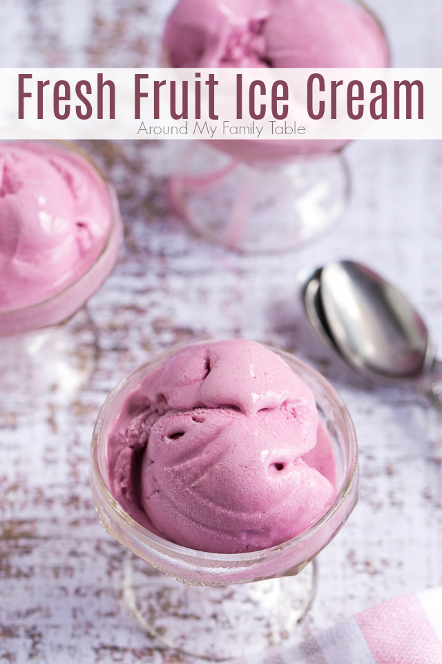 scoops of pink frozen dessert in glass cups with sugar cones on top