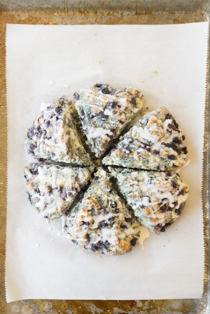 circle of glazed blueberry scones cut into 6 triangles