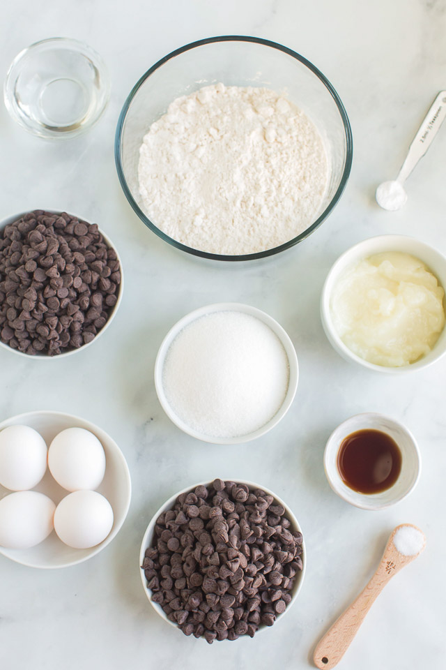 ingredients in bowls and measuring cups to make a healthier brownie recipe