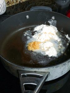 fettuccine alfredo sauce in a pan