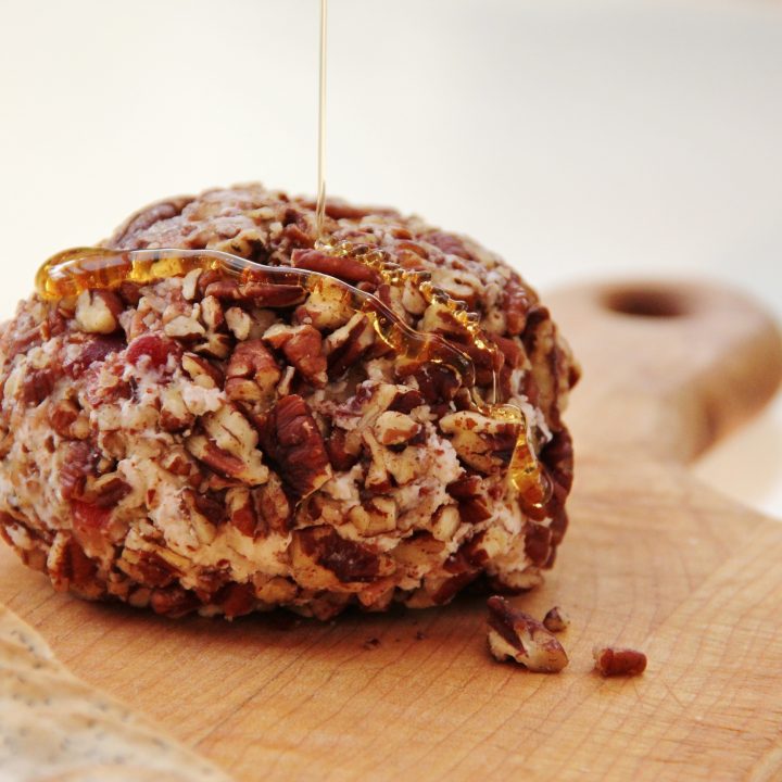 cherry cheese ball on wooden cutting board