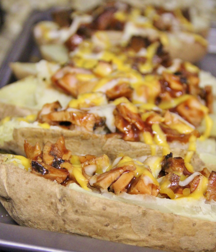 A close up look of Loaded BBQ Potato Skins on a pan