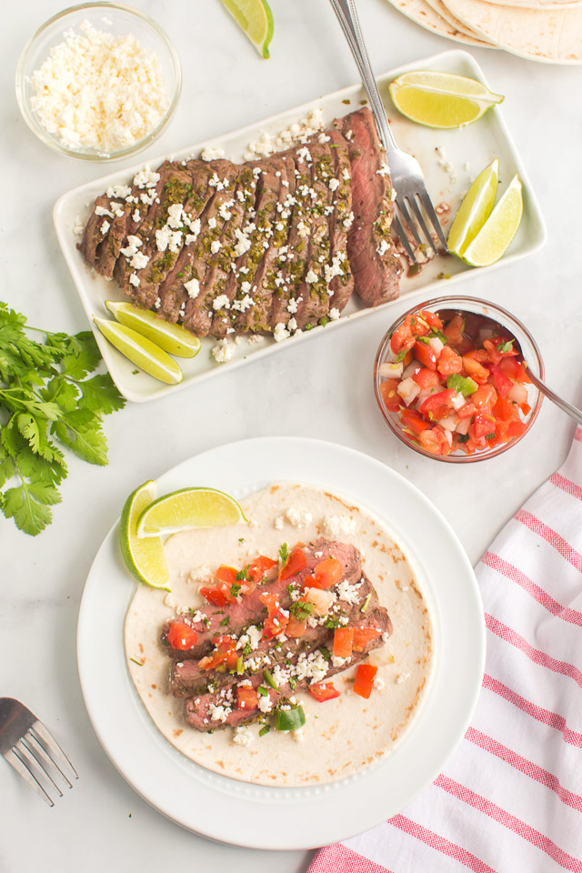 photo shows how to make street tacos: flour tortilla topped with steak street taco mixture