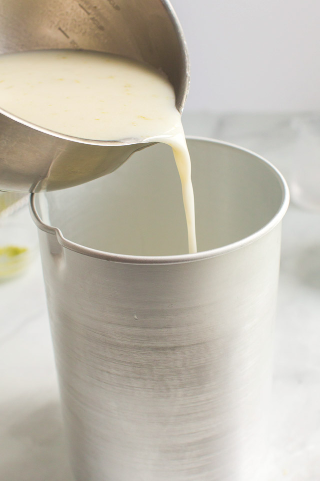 adding ice cream mixture to an ice cream machine