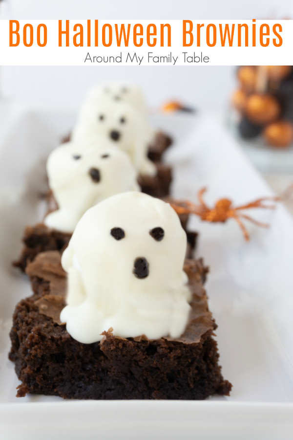 These Boo Halloween Brownies are the cutest. Made with white chocolate marshmallows on top of a delicious brownie....kids love making them as much as they love eating them. #halloween #halloweendesserts #halloweentreats #brownies via @slingmama