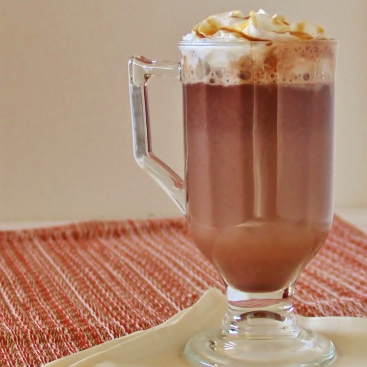 mug of caramel hot cocoa with whipped cream
