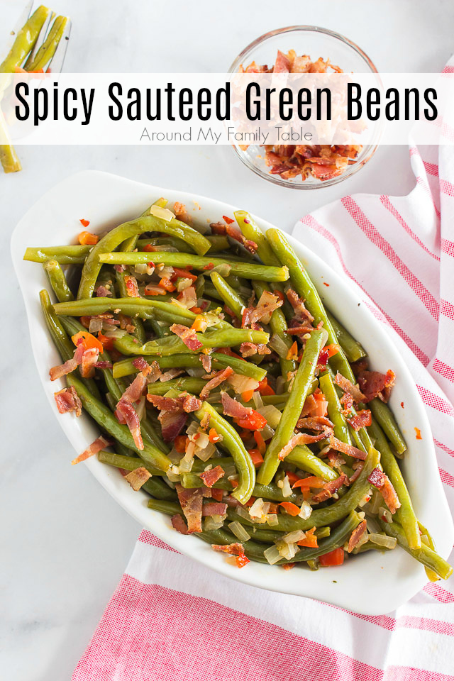 spicy sauteed green beans in a white dish