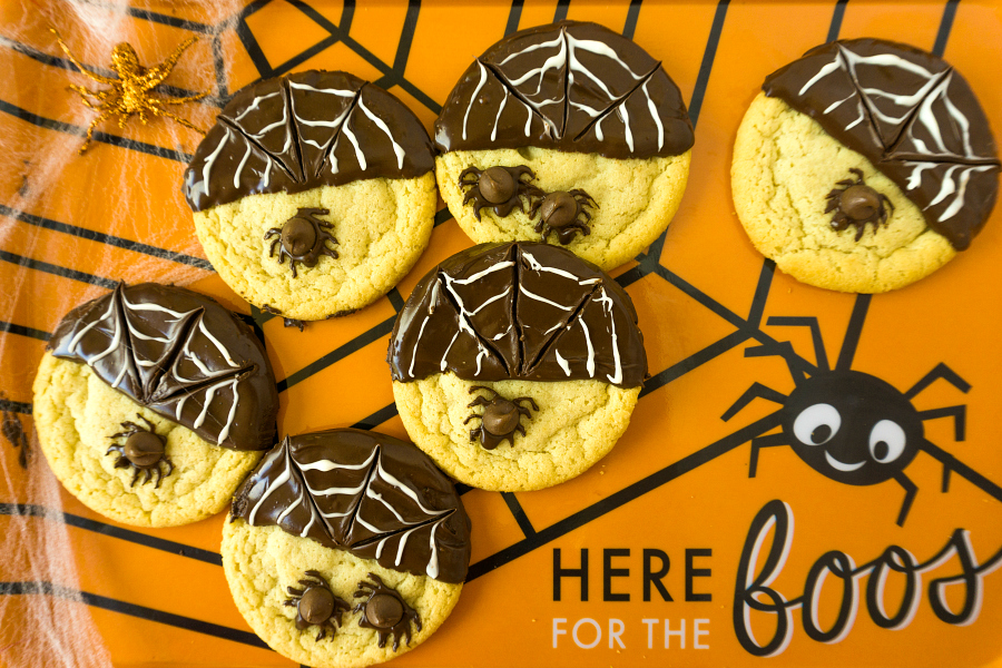 spider cookies on orange platter