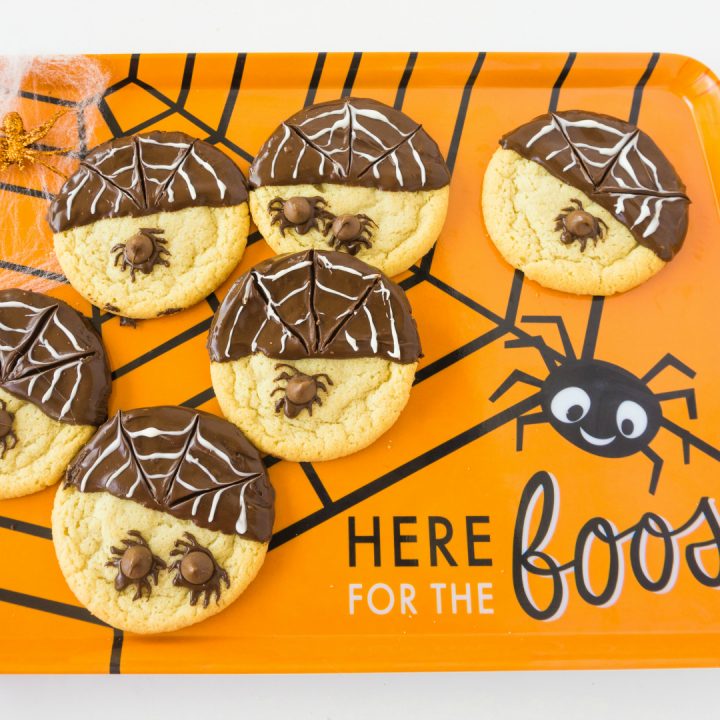 spider cookies on orange platter