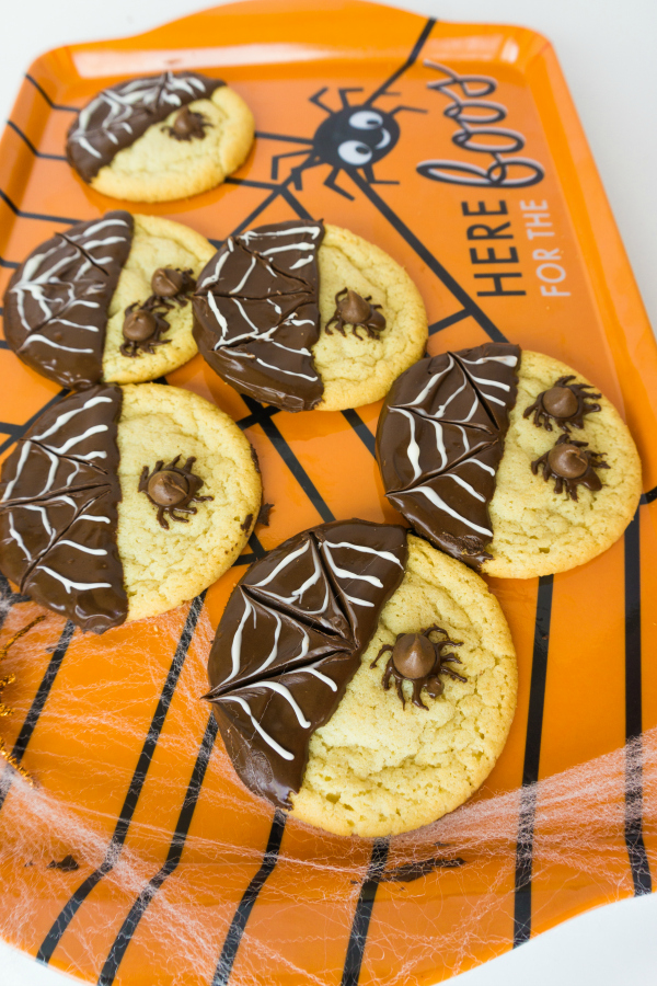 spider cookies on orange platter