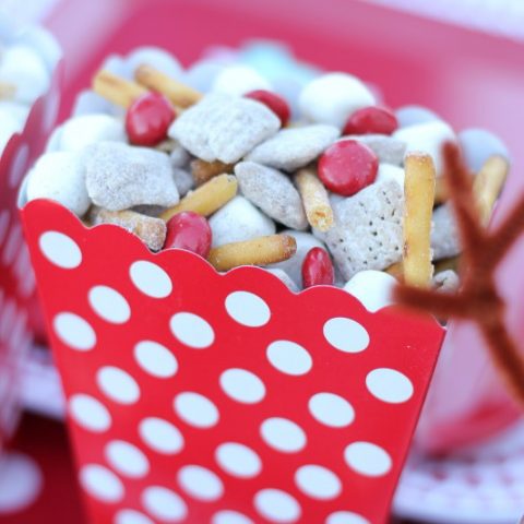 Christmas Snack Mix in a red and white polka dot popcorn box