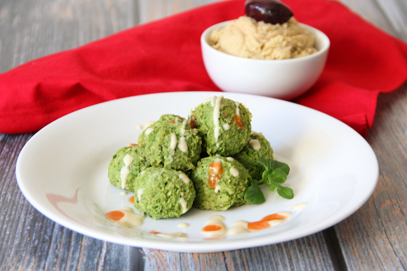 Pea-Afel (Vegan Falafel) on a white plate with hummus