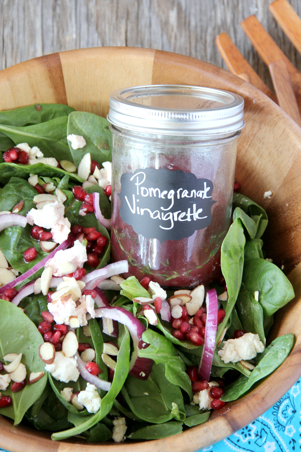 Lighten up with a bowl of POMEGRANATE AND GOAT CHEESE SALAD with an easy and delicious homemade Pomegranate Vinaigrette!