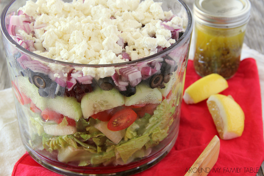 Serve this Layered Greek Salad for supper this week and it will be devoured in no time! Everyone loves how beautiful it is!