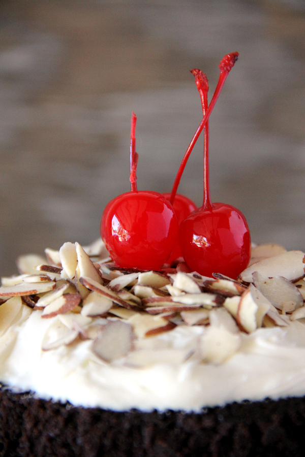 You will never make a plain box of brownies again once you make this stunning BLACK FOREST BROWNIE CAKE with the flavors and look of a traditional Black Forest Cake, but with a decadent chocolate fudge brownie.