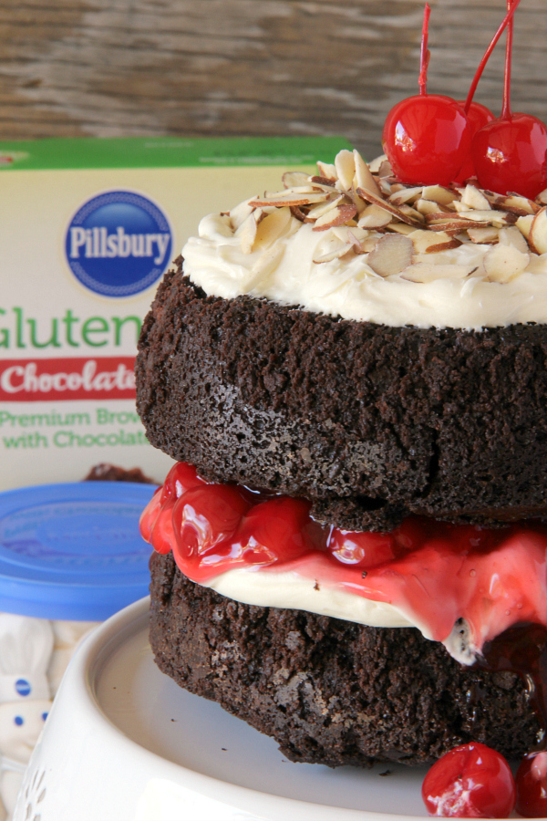 You will never make a plain box of brownies again once you make this stunning BLACK FOREST BROWNIE CAKE with the flavors and look of a traditional Black Forest Cake, but with a decadent chocolate fudge brownie.