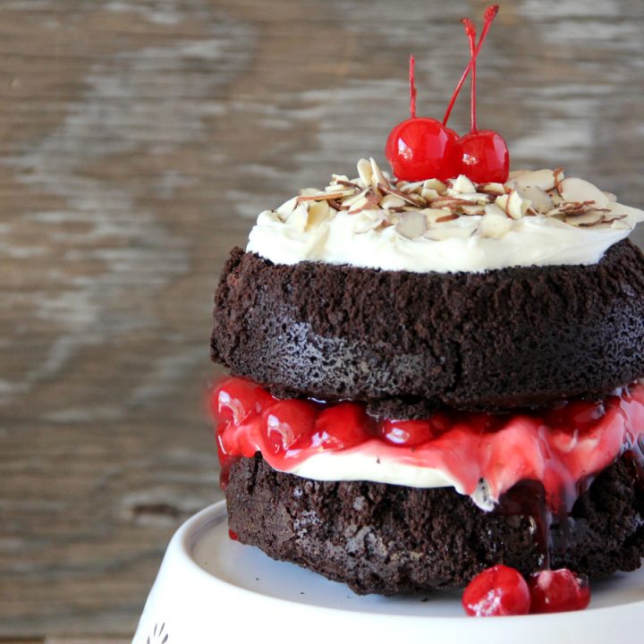 You will never make a plain box of brownies again once you make this stunning BLACK FOREST BROWNIE CAKE with the flavors and look of a traditional Black Forest Cake, but with a decadent chocolate fudge brownie.