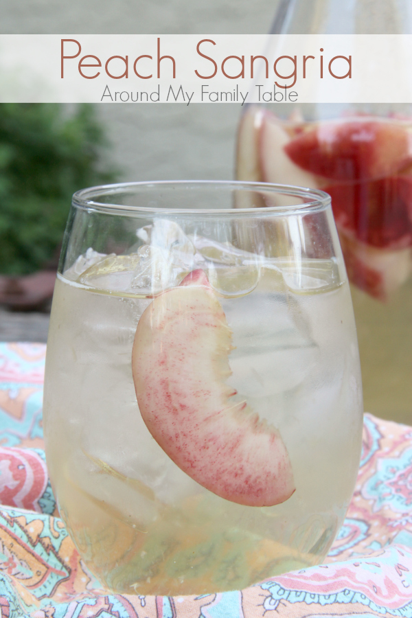Sip on this refreshing PEACH SANGRIA all summer long. Only 4 simple ingredients and tons of peachy goodness!