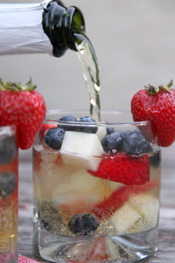 This Red, White, & Blue Sparkling Cider is easy, refreshing, and delicious. It's perfect for party-goers of all ages!