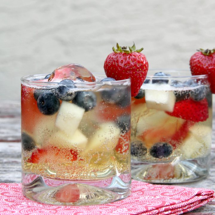 drinking glasses of red white and blue sparkling cider