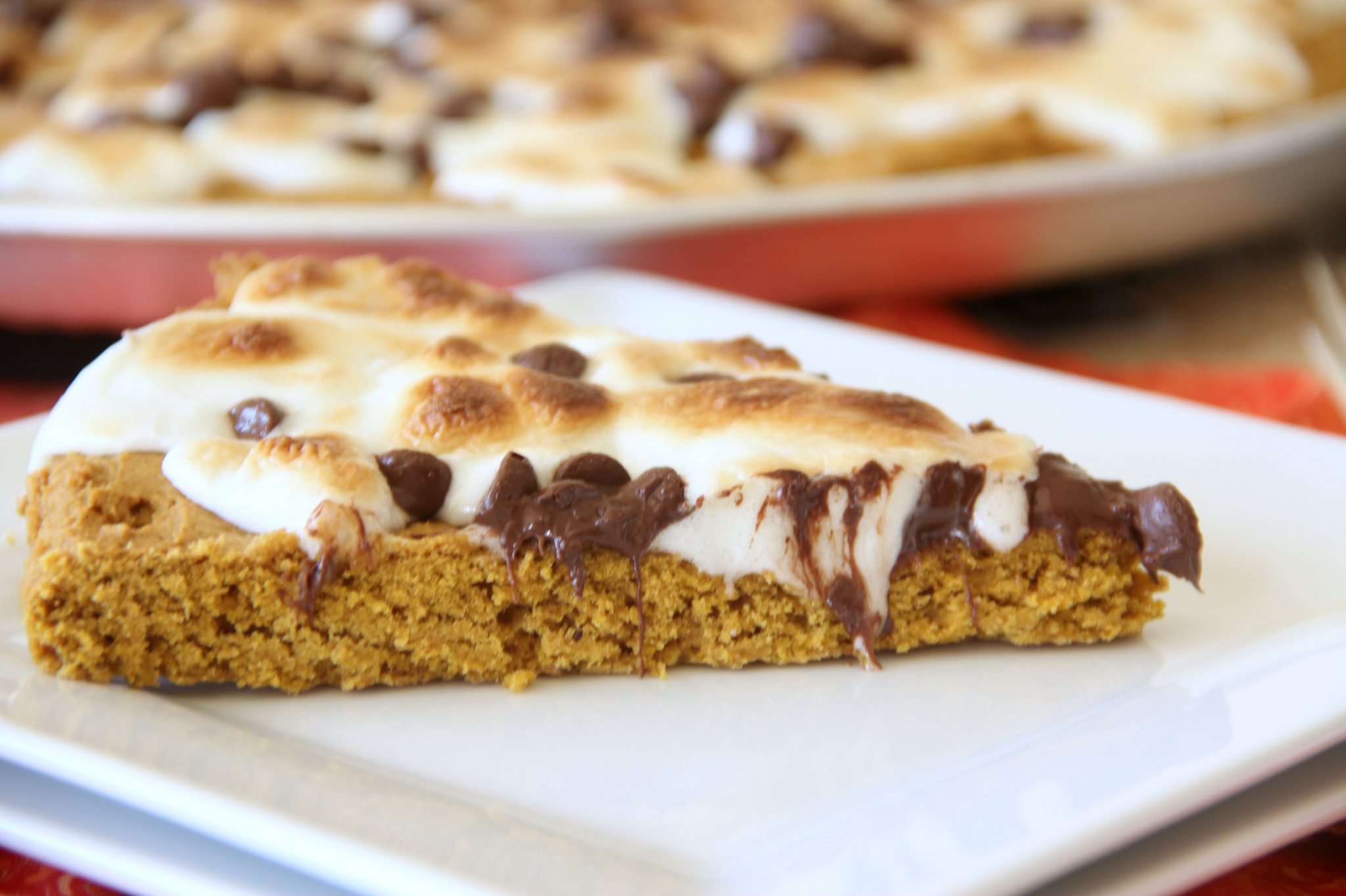 Fall is here and this Pumpkin S'Mores Pizza is scrumptious and the perfect fall dessert! It's such an easy recipe and takes only about 3o minutes!