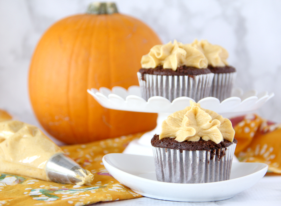 Fall has never tasted so good! Once you try one of these dreamy Chocolate Cupcakes with Pumpkin Buttercream Frosting you'll be reachin' for a second one.