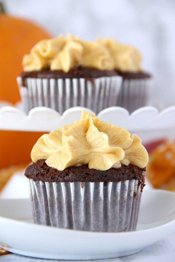 Fall has never tasted so good! Once you try one of these dreamy Chocolate Cupcakes with Pumpkin Buttercream Frosting you'll be reachin' for a second one.