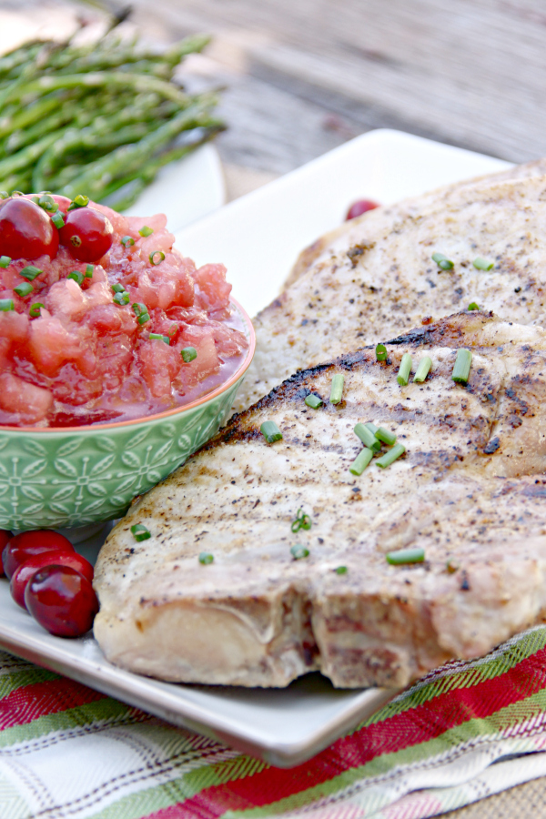 Pork Chops are great year round on the grill with just some simple seasonings, but making these Grilled Pork Chops with Cranberry Applesauce takes supper to a whole new level and turns it into a delicious holiday meal.