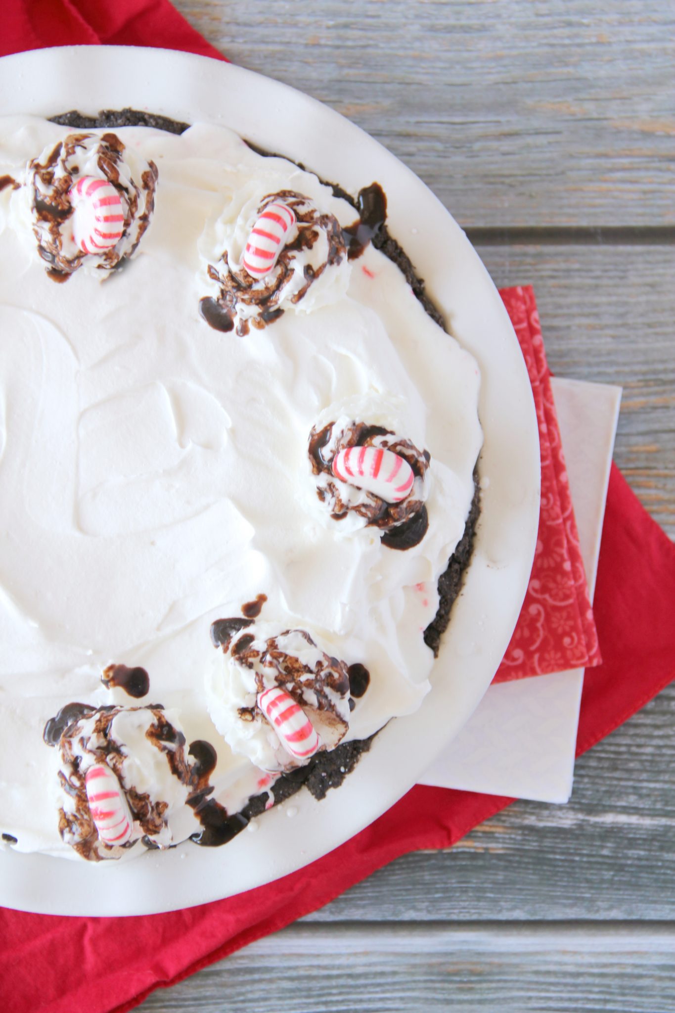 Don't stress about your holiday dessert, this No Bake Chocolate Peppermint Pie is so easy to throw together and uses seasonal peppermint ice cream as the base!