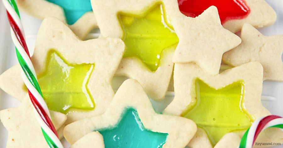 Stained glass cookies are a delicious, beautiful, and easy to make holiday cookie. Soft, buttery cookie dough, rolled out and cut into holiday shapes, then filled with melted candies so they look like stained glass.