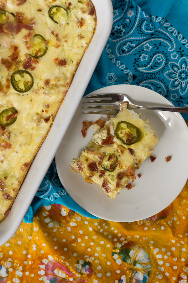 Rise and shine with this delicious Jalapeno Bacon Egg Bake. It's full of bacon, cheesy goodness and great for a late weekend breakfast and absolutely perfect for a potluck!