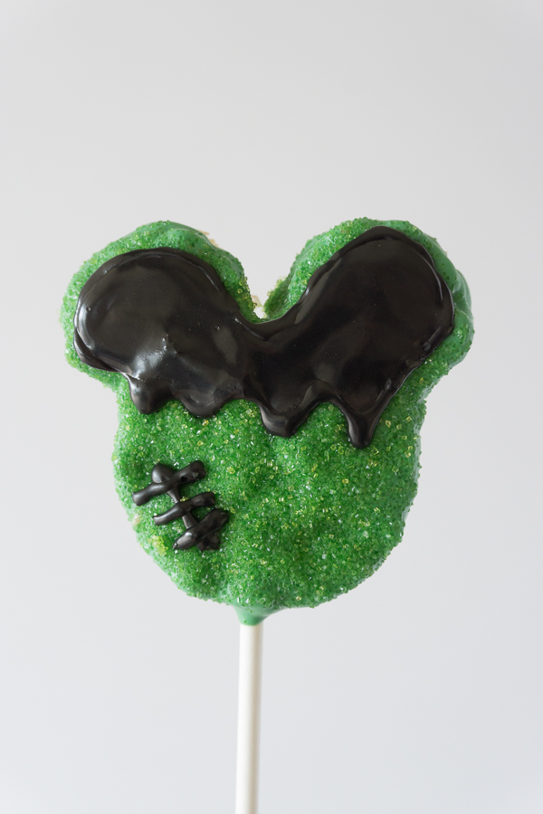 Love this Mickey Frankenstein Crispy Treat! You won't believe how simple and easy these Homemade Disney Halloween Mickey Crispy Treats are to make. 