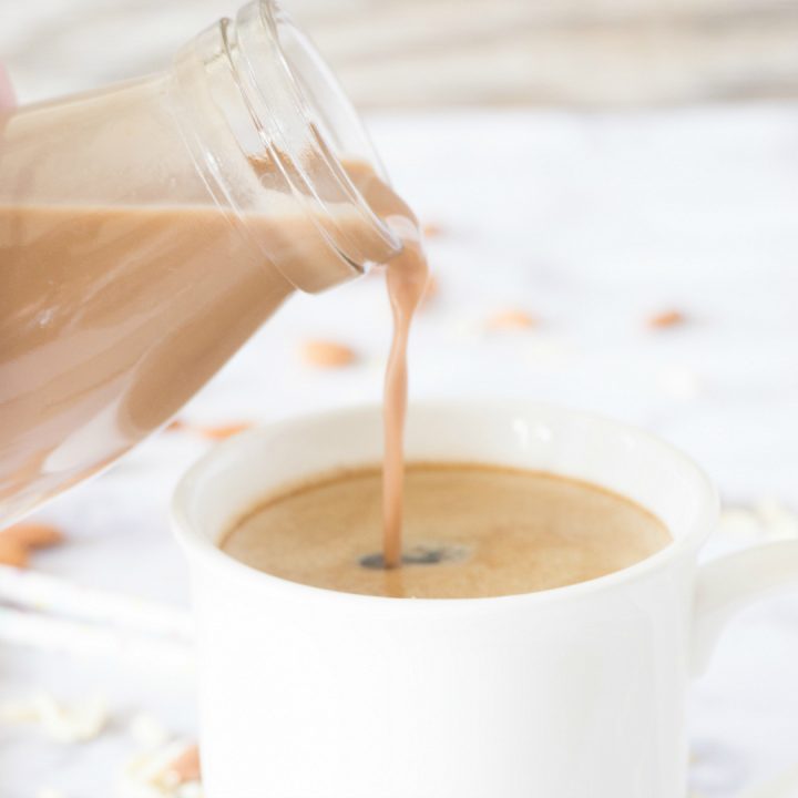 Splurge a little with this thick and creamy dairy free Almond Joy Coffee Creamer.  It's made completely from scratch and just a few basic ingredients like almonds, cocoa powder, sugar, and extracts.