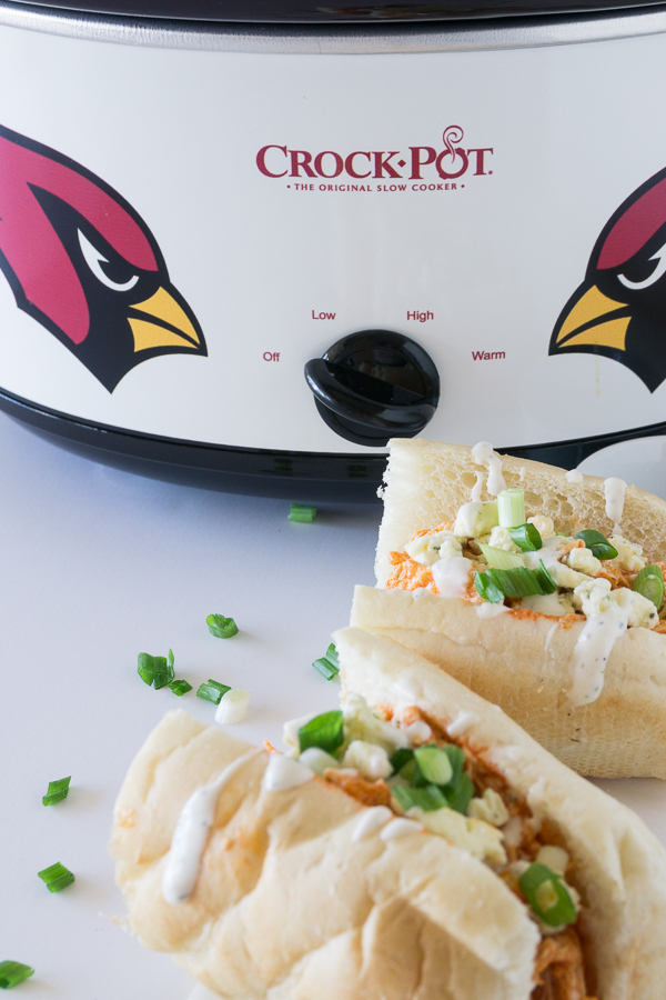 These spicy Slow Cooker Buffalo Chicken Sandwiches are sure to be the hit of any party.  They are perfect for homegating parties, holiday parties, or just for an easy supper.