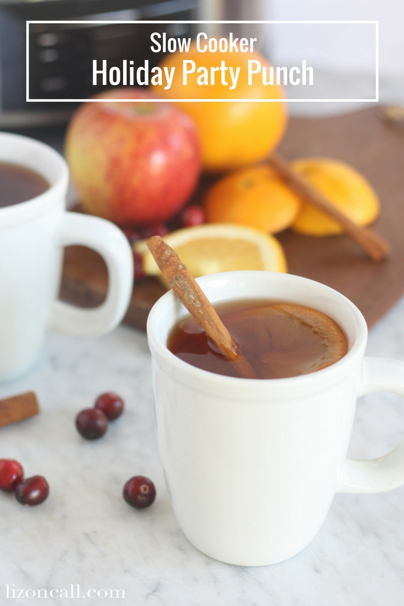 Slow Cooker Party Punch in white mugs