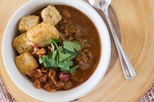 In less than an hour, this Instant Pot Chili Recipe will be hot and ready and taste like it's been simmering all day.  Add all the fixin's for a fun Chili Bar that will be the talk of your homegating party! #chili #chilibar #instantpot