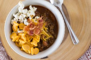 In less than an hour, this Instant Pot Chili Recipe will be hot and ready and taste like it's been simmering all day.  Add all the fixin's for a fun Chili Bar that will be the talk of your homegating party! #chili #chilibar #instantpot