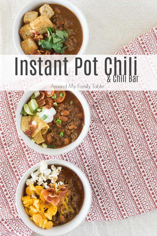 In less than an hour, this Instant Pot Chili Recipe will be hot and ready and taste like it's been simmering all day.  Add all the fixin's for a fun Chili Bar that will be the talk of your homegating party! #chili #chilibar #instantpot