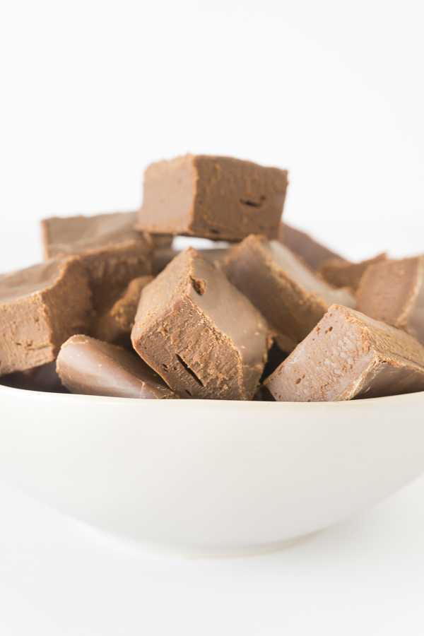 The best fudge recipe is easy to make, doesn't need a candy thermometer, and it's a rich and creamy no bake fudge. The kind of gourmet fudge recipe that makes perfect holiday food gifts! This recipe for no cook fudge really is the best fudge recipe ever! And it only has 3 ingredients and takes just 3 minutes. #chocolatefudge #fudgerecipes