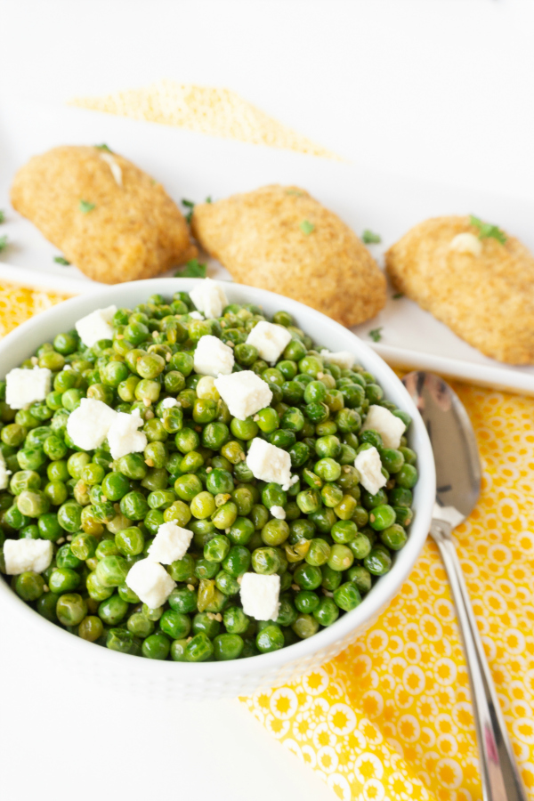 If you haven't tried pan roasted peas you are missing out.  My Roasted Peas with Garlic & Feta is a quick, easy, and delicious side dish.  The sweet flavor of the peas goes nicely with the tangy feta and roasting them just takes the peas to a whole other level.