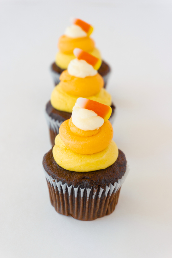 Turn the classic candy corn into these cute and easy Halloween Candy Corn Cupcakes, ideal for class parties or any spooky event.